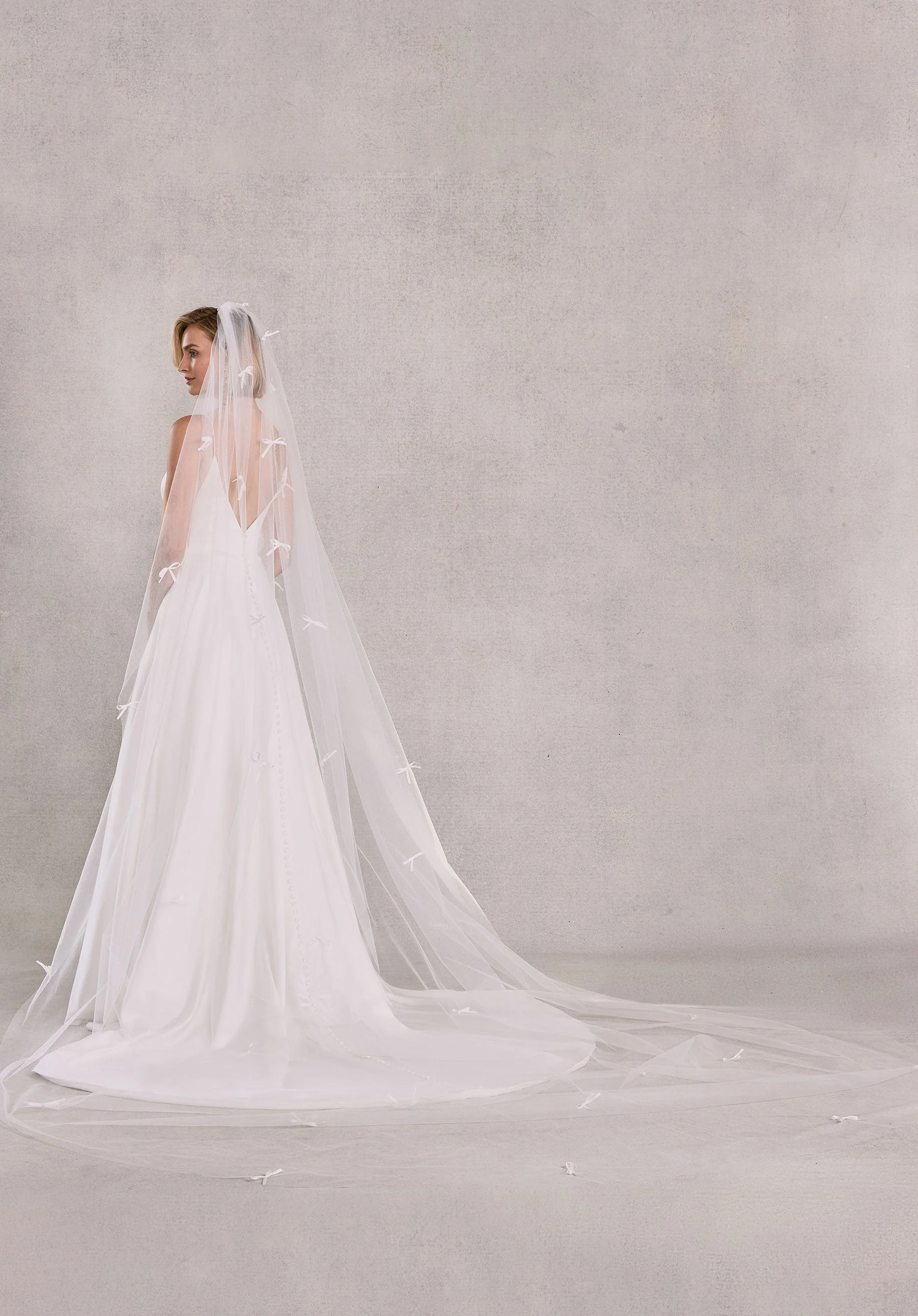 Cathedral Length Tulle Veil with Scattered Satin Bows - Image 2