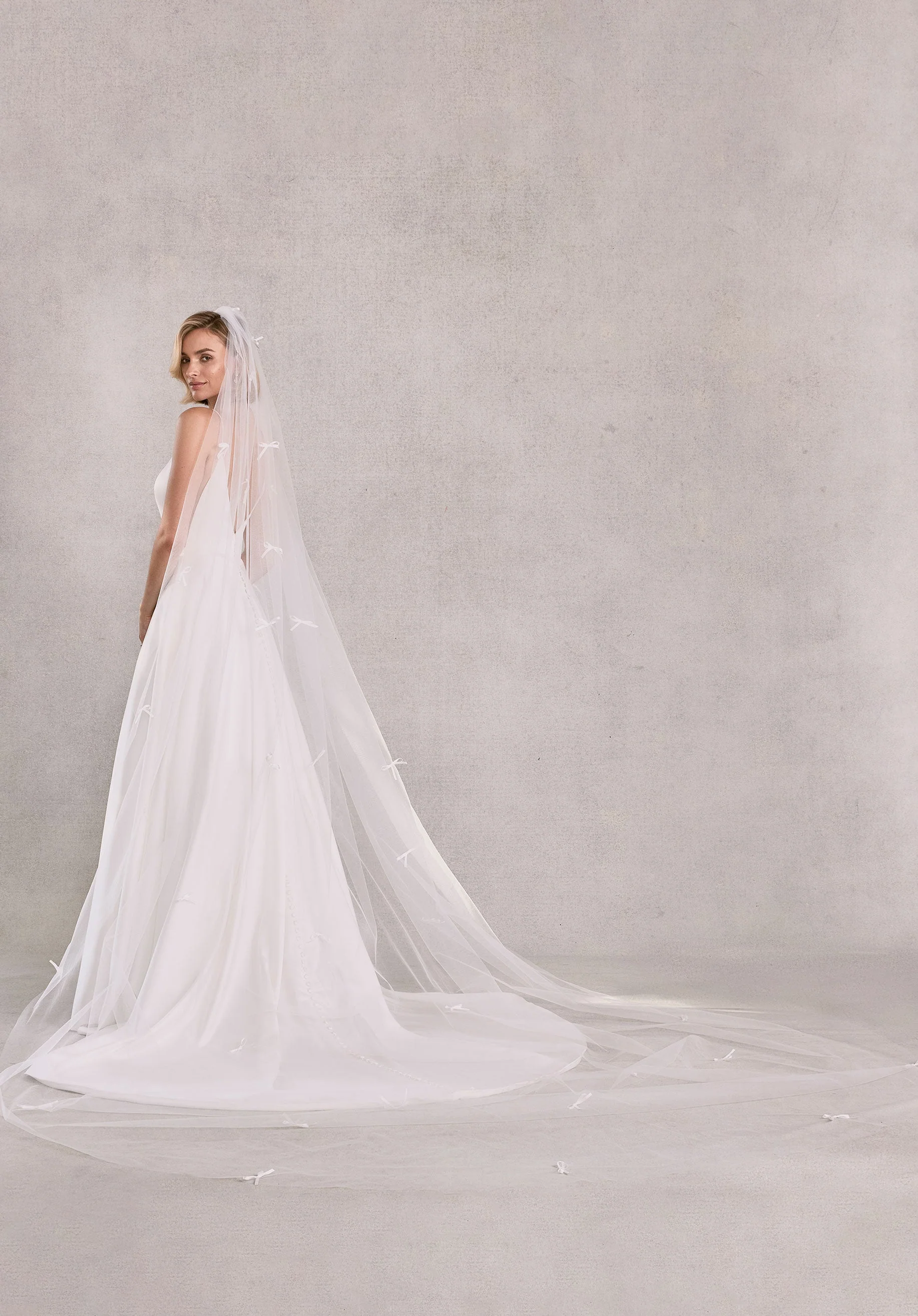 Cathedral Length Tulle Veil with Scattered Satin Bows - Image 6